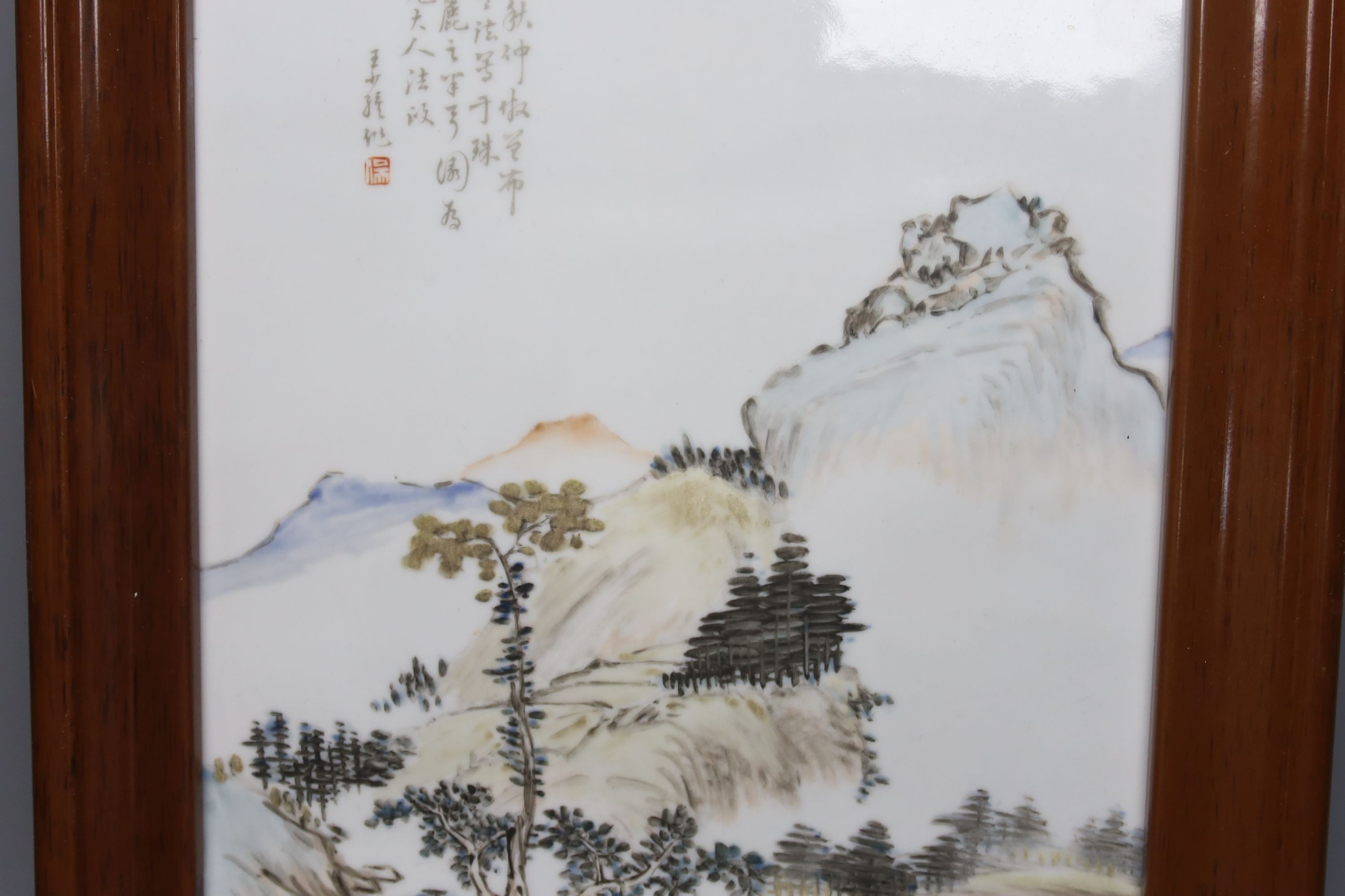 A Chinese porcelain plaque, landscape design with script, 37 x 25cm, in frame